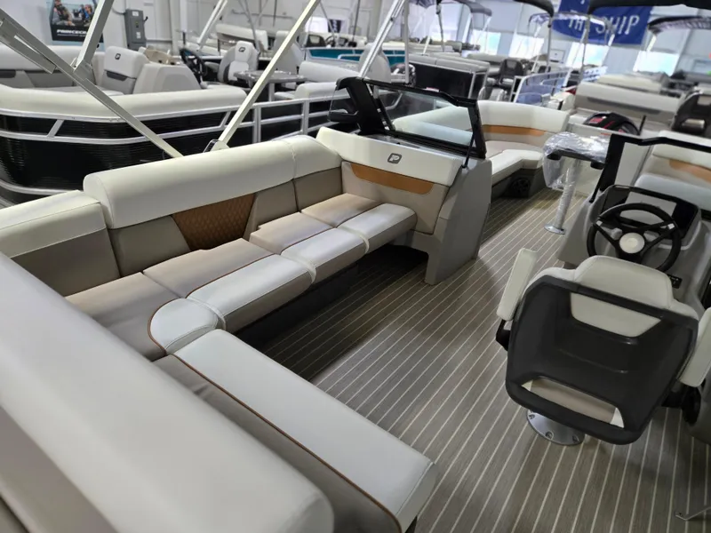 Slide: The Image of 2025 Princecraft Vectra 23 WRL pontoon boat interior with luxurious seating and modern design. - 9