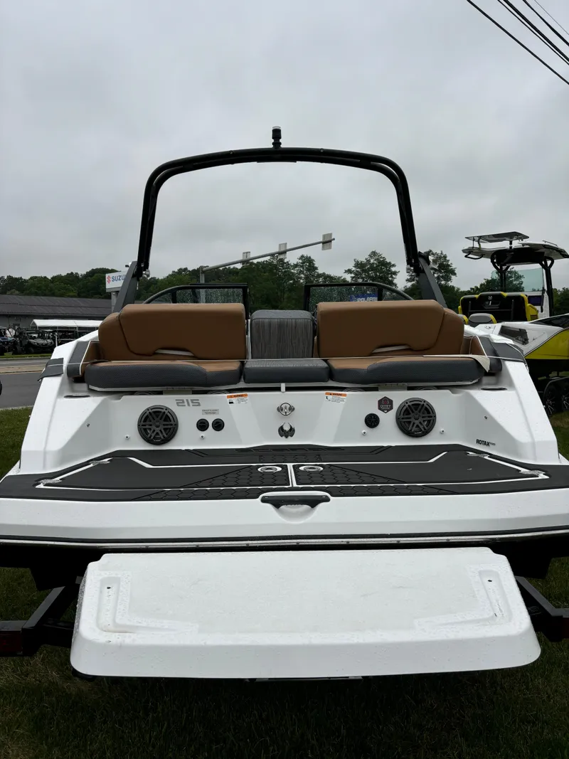 Slide: The Image of 2024 Scarab 215 H.O. Platinum boat, rear view with seating and speakers. - 3