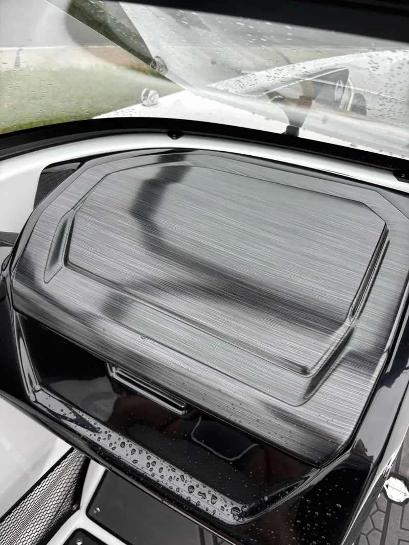 Slide: The Image of 2024 Scarab 215 H.O. Platinum dashboard with sleek design and raindrops. - 6