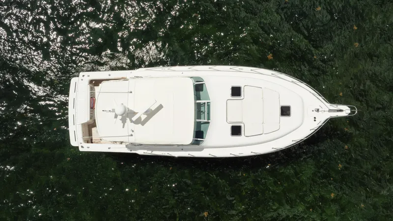 Slide: The Image of Overhead view of a 1998 Tiara Yachts 4300 Open on shimmering water. - 10
