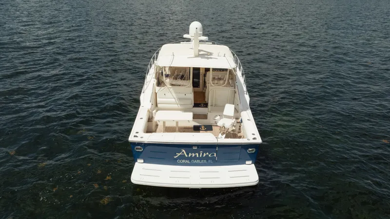 Slide: The Image of 1998 Tiara Yachts 4300 Open on water, rear view, named "Amira" from Coral Gables, FL. - 11