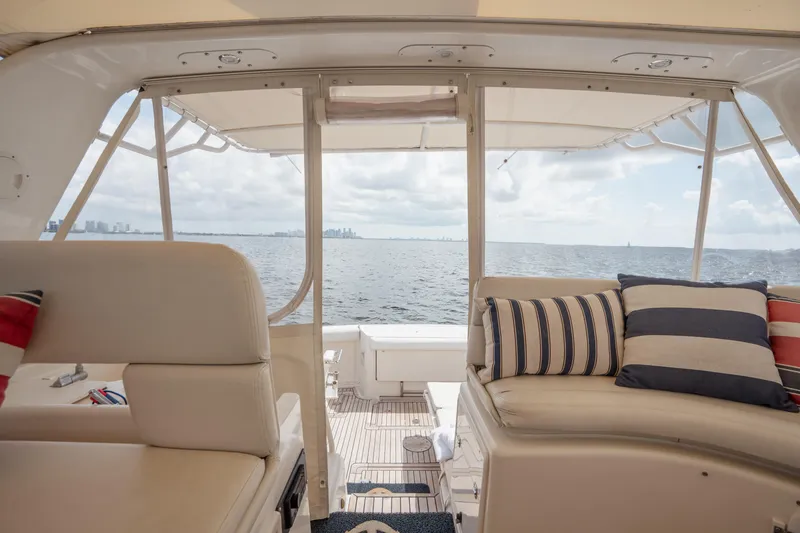 Slide: The Image of Interior view of 1998 Tiara Yachts 4300 Open, featuring comfortable seating and ocean backdrop. - 23