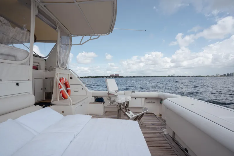 Slide: The Image of 1998 Tiara Yachts 4300 Open, spacious deck with ocean view, clear sky. - 30