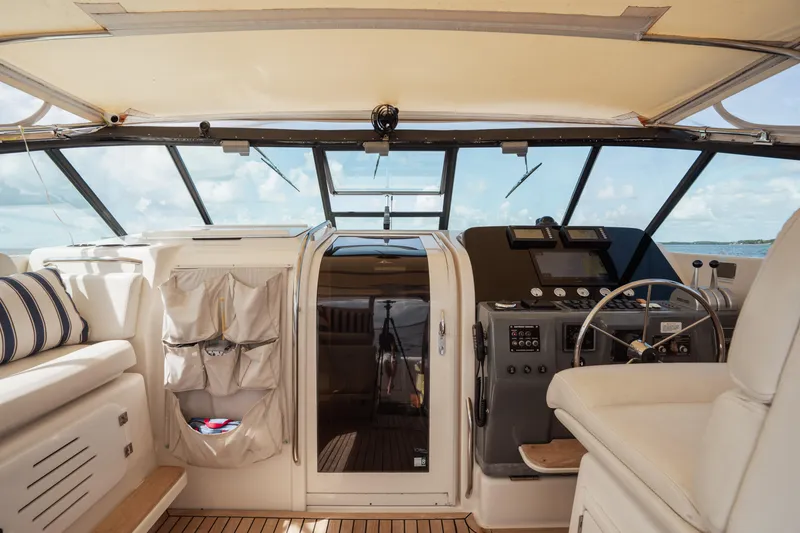 Slide: The Image of Interior view of 1998 Tiara Yachts 4300 Open, featuring helm and seating area. - 33