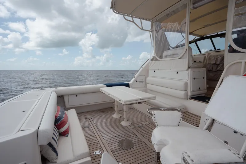Slide: The Image of 1998 Tiara Yachts 4300 Open deck with seating, table, and ocean view. - 35