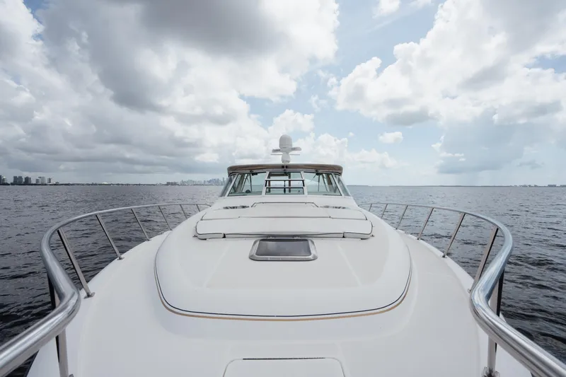 Slide: The Image of 1998 Tiara Yachts 4300 Open cruising on open water under cloudy skies. - 37