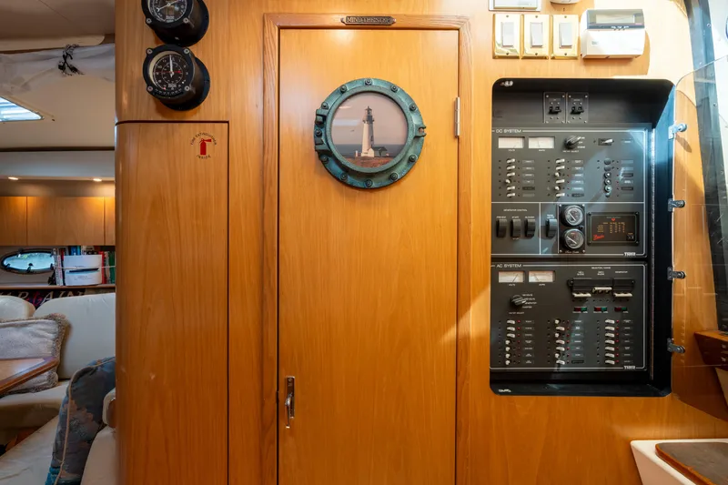 Slide: The Image of Interior of 1998 Tiara Yachts 4300 Open with control panel and wooden cabinetry. - 41