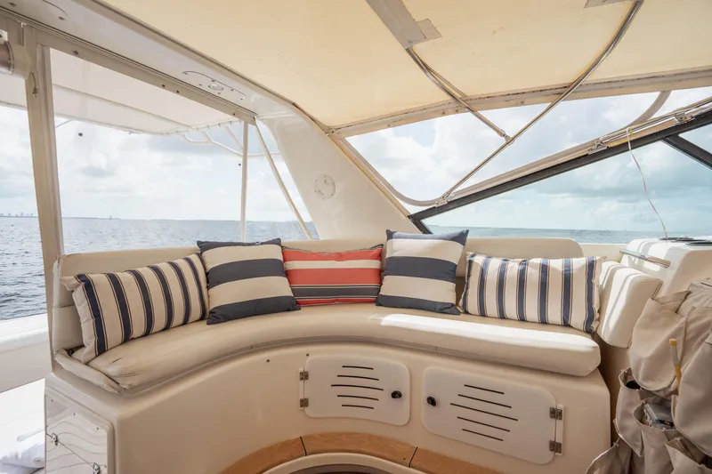 Slide: The Image of Cozy seating area on a 1998 Tiara Yachts 4300 Open with striped cushions, ocean view. - 42