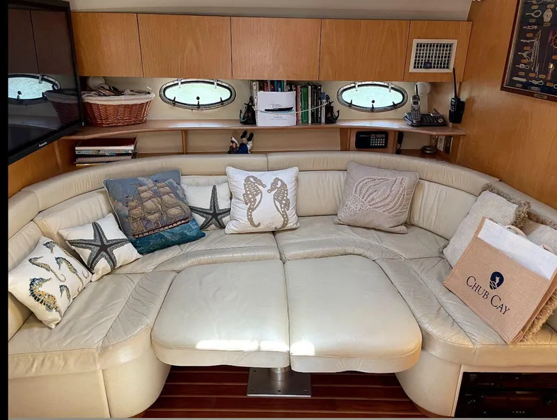 Slide: The Image of Luxurious 1998 Tiara Yachts 4300 Open interior with plush seating and nautical-themed decor. - 47