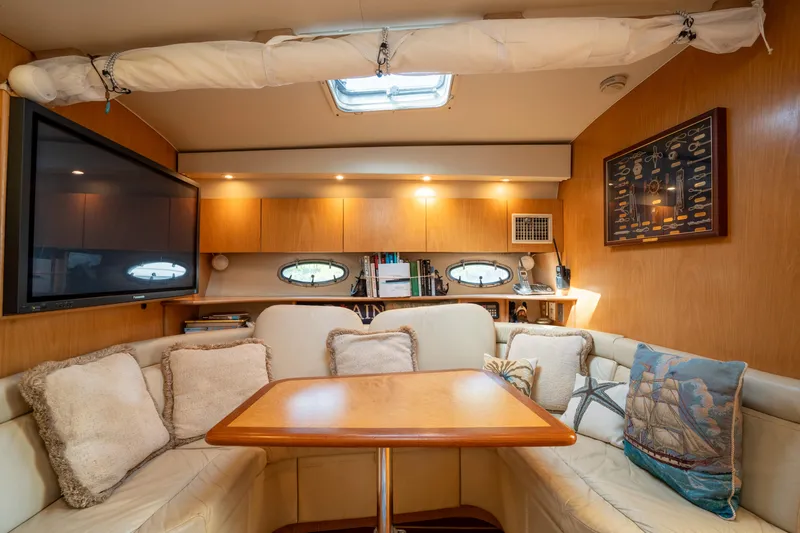 Slide: The Image of Luxurious interior of 1998 Tiara Yachts 4300 Open with cozy seating and elegant decor. - 48