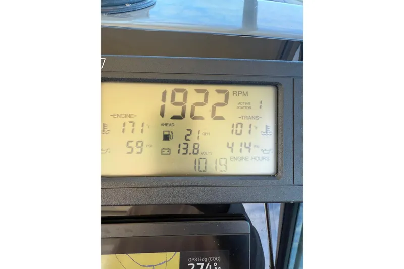 Slide: The Image of Dashboard of a 1998 Tiara Yachts 4300 Open showing engine metrics and RPM. - 55