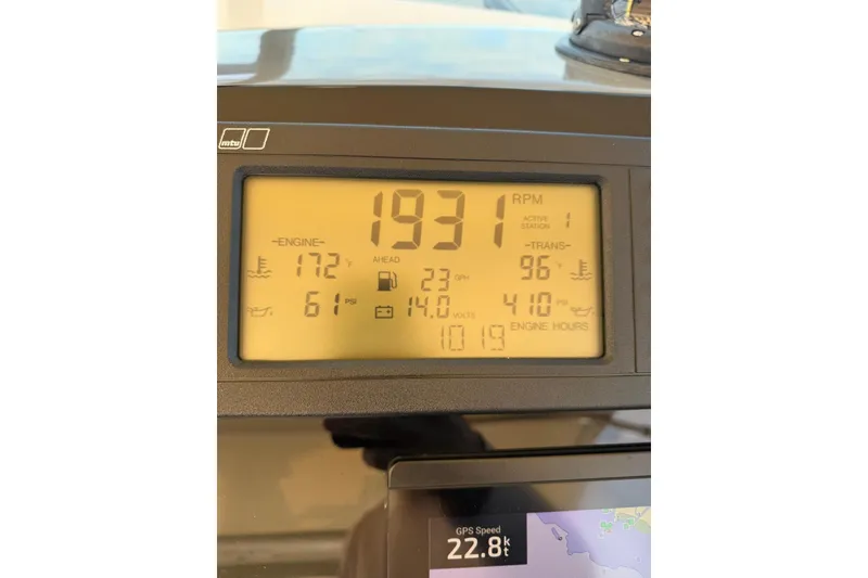 Slide: The Image of Dashboard display of a 1998 Tiara Yachts 4300 Open, showing engine and GPS data. - 56
