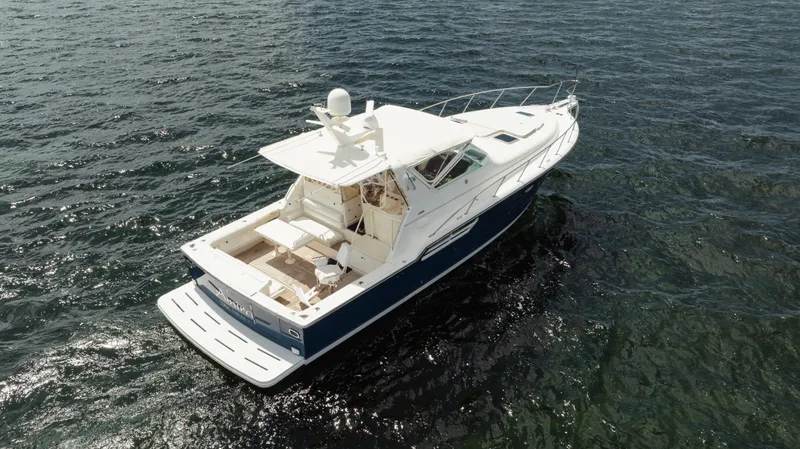 Slide: The Image of 1998 Tiara Yachts 4300 Open cruising on open water, aerial view. - 6