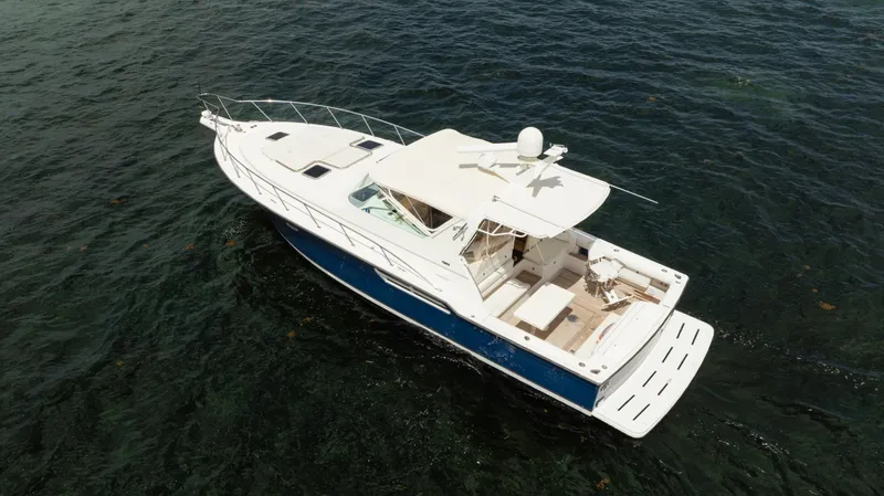 Slide: The Image of 1998 Tiara Yachts 4300 Open cruising on the water, aerial view. - 7