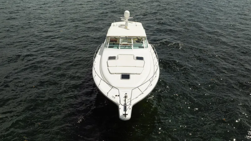 Slide: The Image of 1998 Tiara Yachts 4300 Open cruising on open water, aerial view. - 9