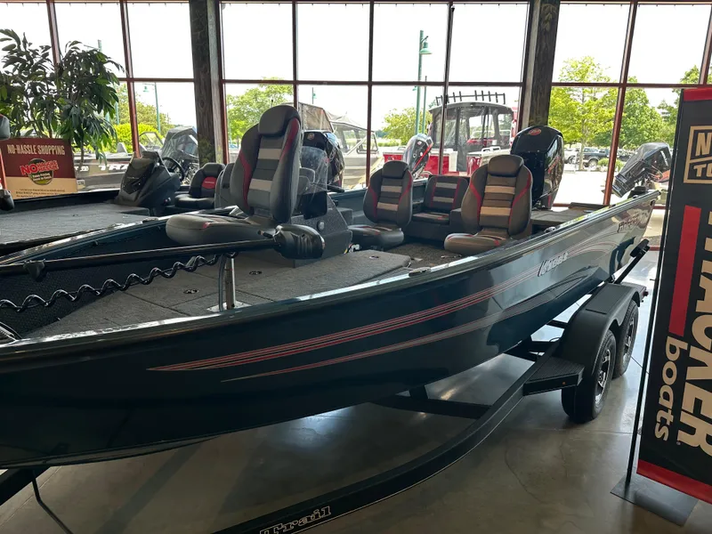 Slide: The Image of 2025 Ranger VS1882SC Reata boat displayed in showroom with seating and motor. - 1