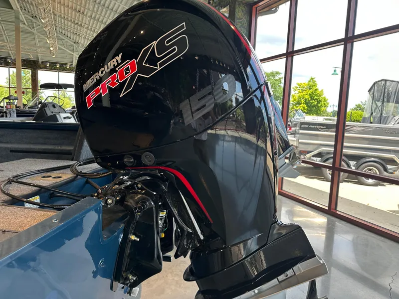 Slide: The Image of 2025 Ranger VS1882SC Reata with Mercury Pro XS 150 outboard motor in showroom. - 3