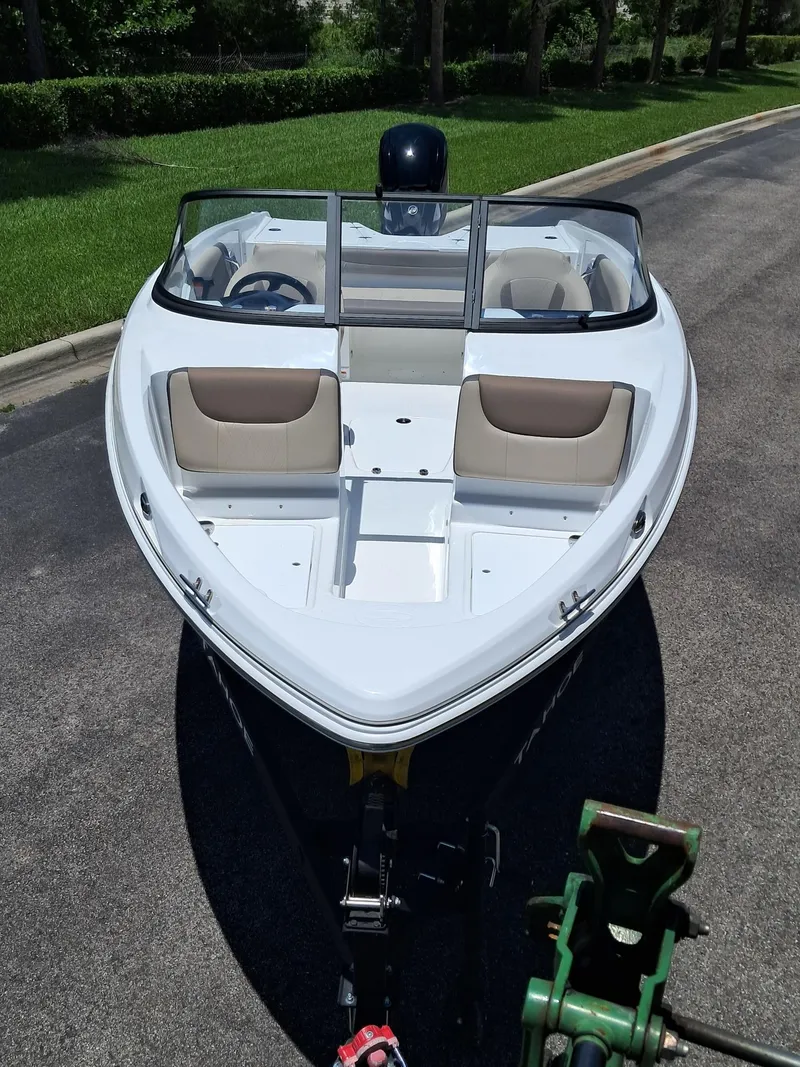 Slide: The Image of 2025 Tahoe 200 S boat on trailer, parked on a sunny day. - 5