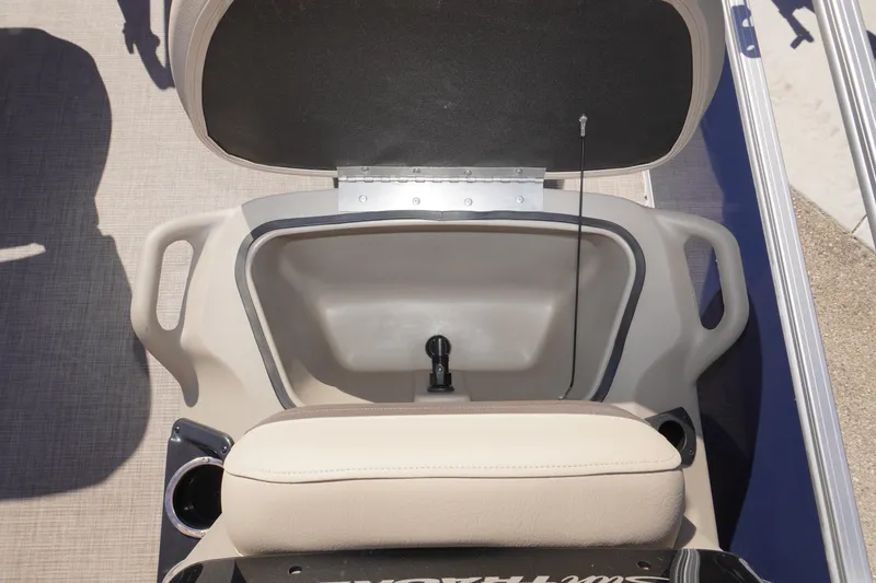 Slide: The Image of Open storage compartment on 2025 Sun Tracker Bass Buggy 16 XL Select boat. - 11