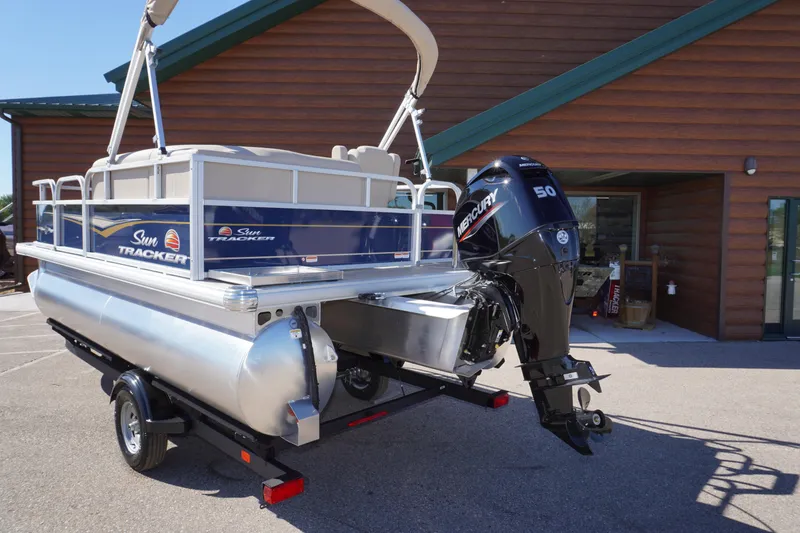 Slide: The Image of 2025 Sun Tracker Bass Buggy 16 XL Select pontoon boat with Mercury 50 engine. - 2