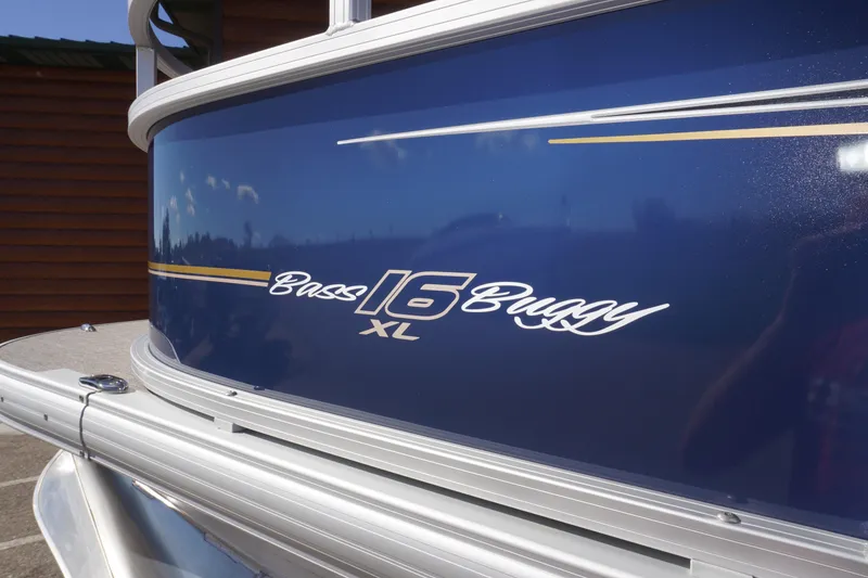Slide: The Image of 2025 Sun Tracker Bass Buggy 16 XL Select pontoon boat, blue exterior detail. - 3