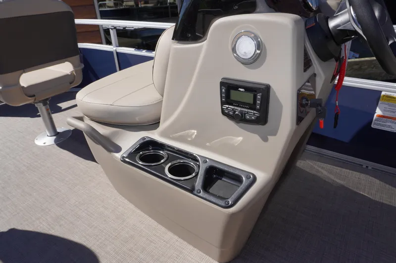 Slide: The Image of 2025 Sun Tracker Bass Buggy 16 XL Select console with cup holders and control panel. - 9