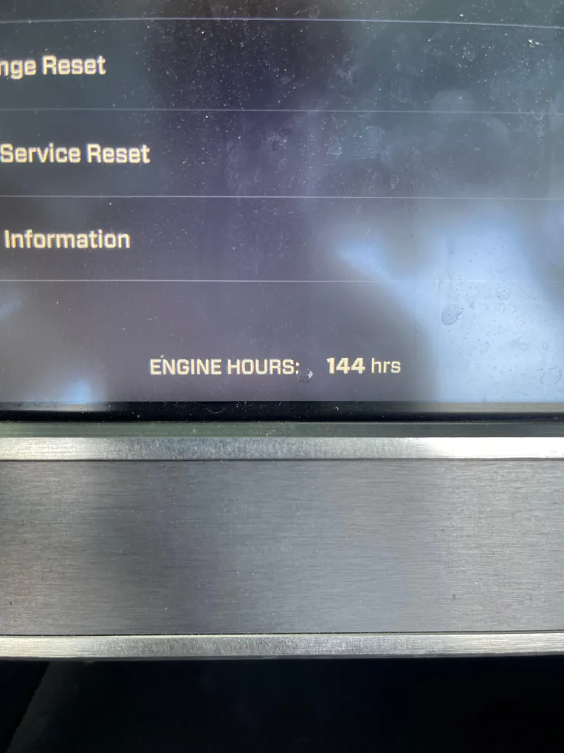 Slide: The Image of 2020 MasterCraft XT23 display showing 144 engine hours. - 10