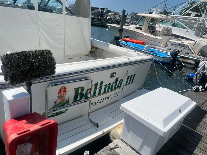 Slide: The Image of 1989 Tiara Yachts 33OPEN docked, featuring "Belinda III" name, Niantic, CT. - 1