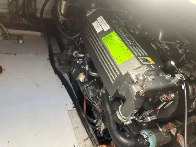 Slide: The Image of Engine compartment of a 1989 Tiara Yachts 33OPEN, showcasing mechanical components. - 13