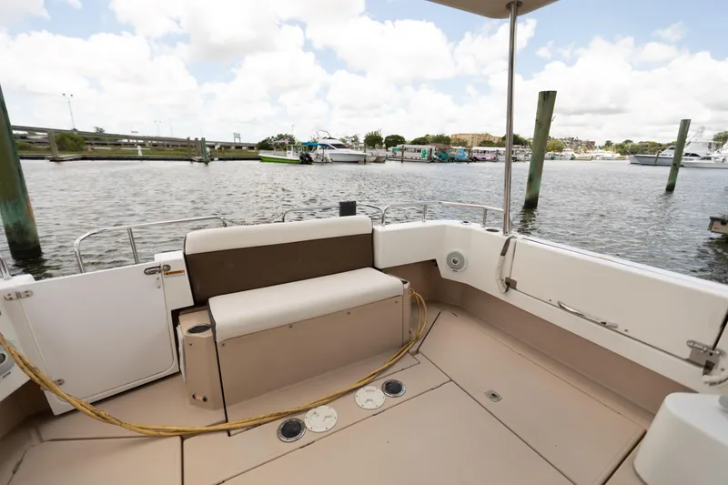 Slide: The Image of 2017 Ranger Tugs R-31 CB boat interior with seating, docked at marina. - 2