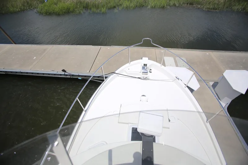 Slide: The Image of 2017 Ranger Tugs R-31 CB boat docked at a marina, viewed from above. - 9