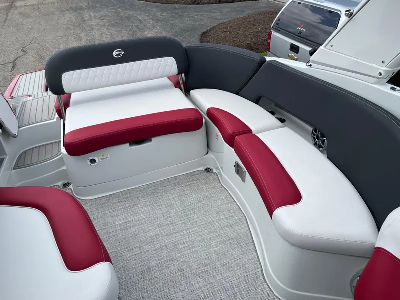 Slide: The Image of 2026 Crownline 298 SS boat interior with red and white seating, featuring modern design. - 11