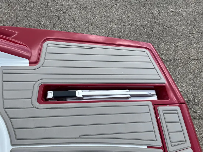 Slide: The Image of 2026 Crownline 298 SS boat deck with integrated storage compartment. - 15