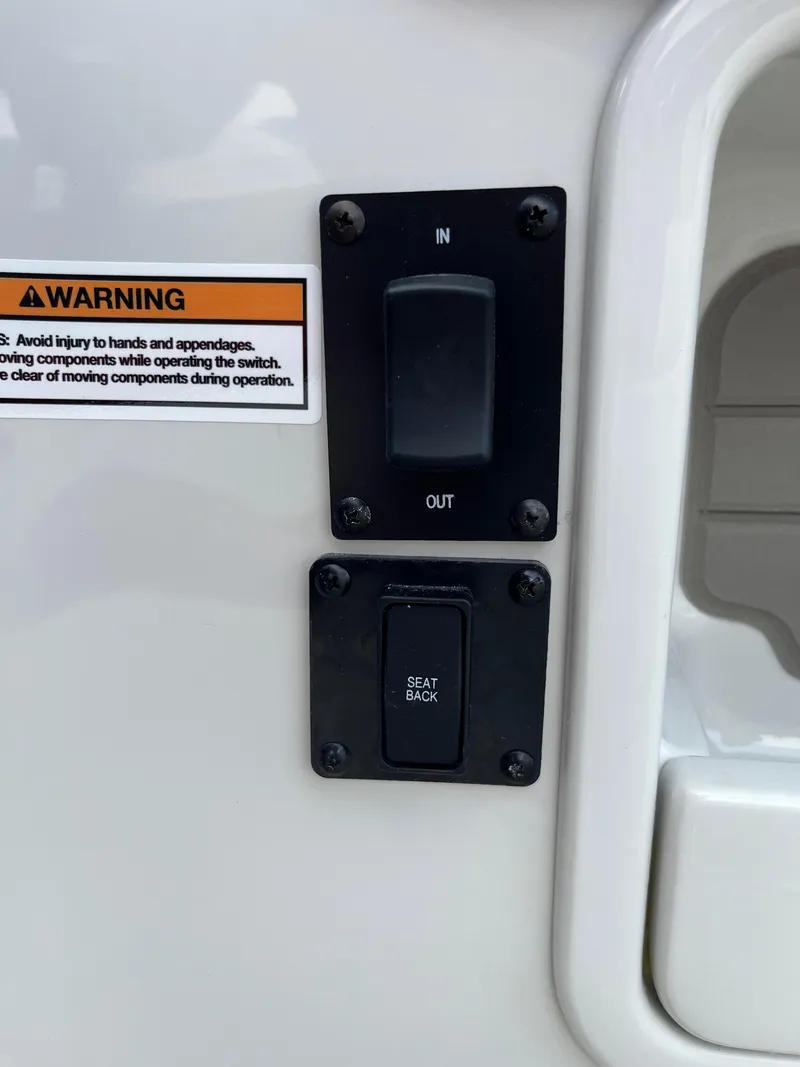 Slide: The Image of Control panel with warning label on 2026 Crownline 298 SS boat. - 25