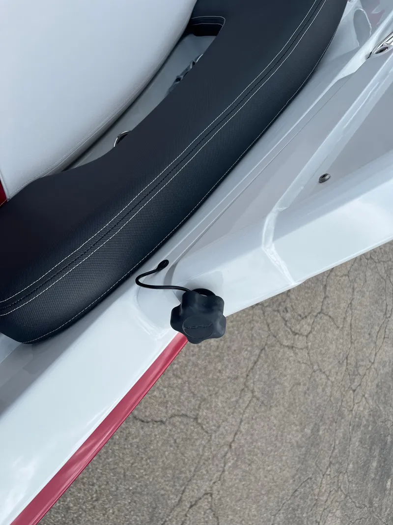 Slide: The Image of 2026 Crownline 298 SS boat seat detail with black cushion and white stitching. - 27