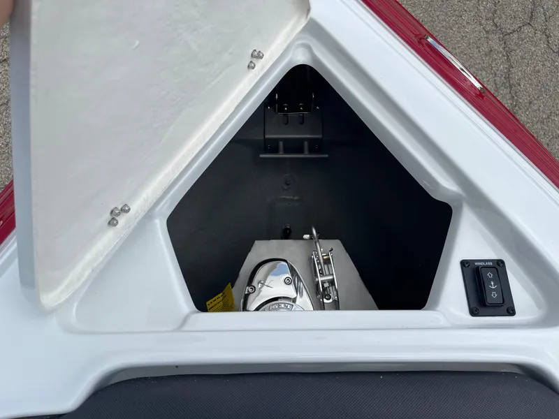 Slide: The Image of 2026 Crownline 298 SS boat anchor compartment with windlass control. - 3