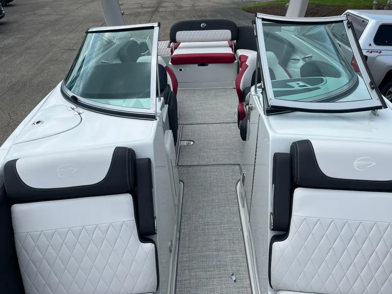 Slide: The Image of 2026 Crownline 298 SS boat interior with white and black seating, open windshield. - 6