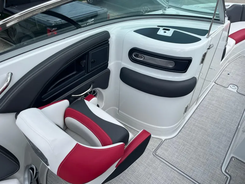 Slide: The Image of 2026 Crownline 298 SS boat interior with red and white seating, sleek design. - 9