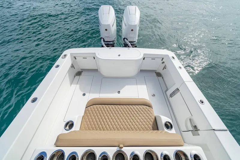 Slide: The Image of 2026 Valhalla Boatworks V-33 with dual engines, featuring a spacious deck and cushioned seating. - 11