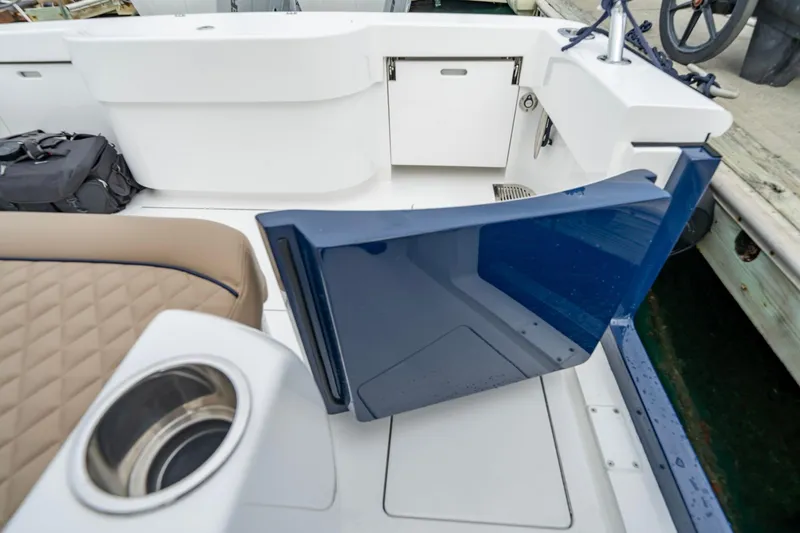 Slide: The Image of 2026 Valhalla Boatworks V-33 interior with blue door and tan seating. - 12