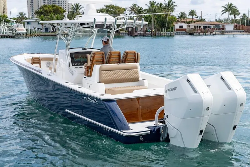 Slide: The Image of 2026 Valhalla Boatworks V-33 cruising on water with dual Mercury engines. - 3