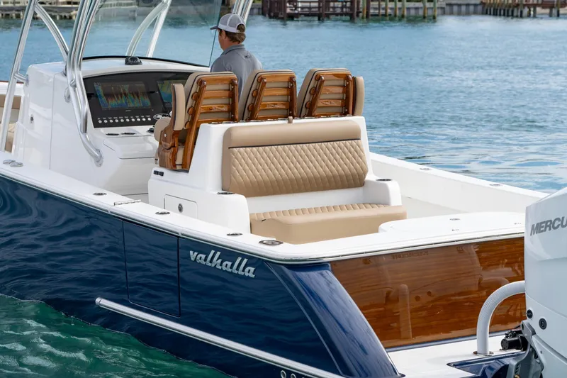 Slide: The Image of 2026 Valhalla Boatworks V-33 with luxurious seating and advanced navigation system on water. - 4