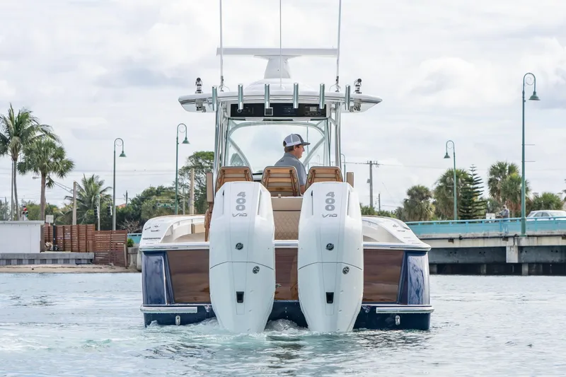 Slide: The Image of 2026 Valhalla Boatworks V-33 with dual 400 V10 engines cruising on water. - 5