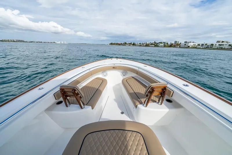 Slide: The Image of 2026 Valhalla Boatworks V-33 on open water, featuring luxurious seating and sleek design. - 6