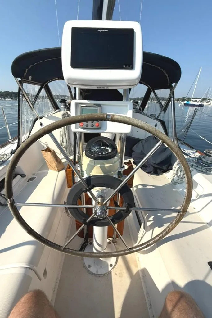 Slide: The Image of Steering wheel and navigation equipment on a 1986 Pearson 33-2 sailboat. - 10