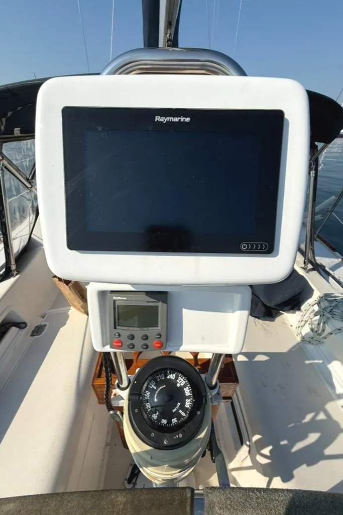 Slide: The Image of Cockpit of 1986 Pearson 33-2 sailboat with Raymarine navigation equipment and compass. - 11