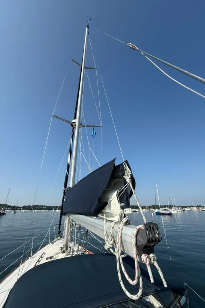 Slide: The Image of Sailboat Pearson 33-2, 1986 model, with mast and rigging against clear blue sky. - 13