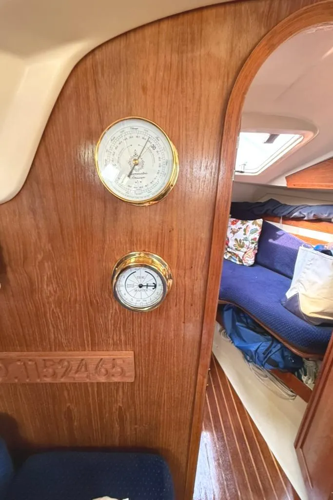 Slide: The Image of Interior of 1986 Pearson 33-2 sailboat with wooden paneling and nautical instruments. - 17
