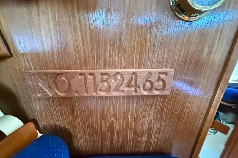 Slide: The Image of Wooden interior of 1986 Pearson 33-2 sailboat with carved number 1152465. - 18