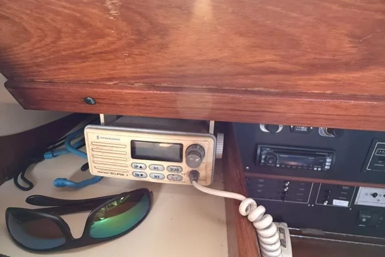 Slide: The Image of VHF radio and sunglasses on a Pearson 33-2 sailboat, 1986 model. - 25